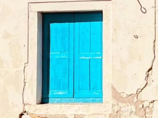 An old blue window